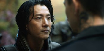 Movie still from “Altered Carbon” (2018), created by Laeta Kalogridis – A person with long black hair; Close Up shot, Over the shoulder angle