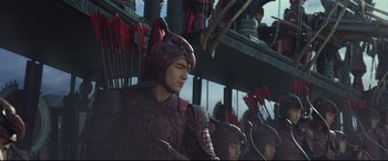 Movie still from “The Great Wall” (2016), directed by Yimou Zhang – A group of men in red and black costumes; Medium shot, Low angle