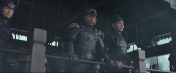 Movie still from “The Great Wall” (2016), directed by Yimou Zhang – A group of men wearing armor and holding a stick; Medium shot, Low angle