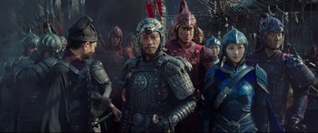 Movie still from “The Great Wall” (2016), directed by Yimou Zhang – A group of men in armor standing next to each other; Medium shot, Over the shoulder angle