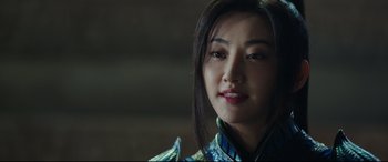 Movie still from “The Great Wall” (2016), directed by Yimou Zhang – A young woman in a blue and white dress; Close Up shot, Over the shoulder angle
