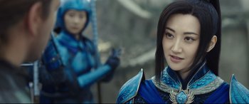 Movie still from “The Great Wall” (2016), directed by Yimou Zhang – A woman in a blue outfit standing next to another woman in a blue outfit; Close Up shot, Over the shoulder angle