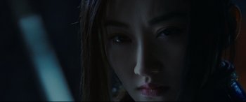 Movie still from “The Great Wall” (2016), directed by Yimou Zhang – The face of a young asian woman; Extreme Close Up shot, Low angle