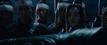 Movie still from “The Great Wall” (2016), directed by Yimou Zhang – A group of people with bandanas on their heads; Close Up shot, Over the shoulder angle