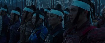 Movie still from “The Great Wall” (2016), directed by Yimou Zhang – A group of men in traditional chinese clothing; Medium shot, Over the shoulder angle