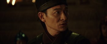 Movie still from “The Great Wall” (2016), directed by Yimou Zhang – A person wearing a hat; Close Up shot, Over the shoulder angle