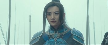 Movie still from “The Great Wall” (2016), directed by Yimou Zhang – A woman with long hair wearing a blue and black outfit; Close Up shot, Low angle
