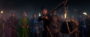 Movie still from “The Great Wall” (2016), directed by Yimou Zhang – A group of people dressed in medieval costumes; Medium shot, Over the shoulder angle