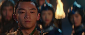 Movie still from “The Great Wall” (2016), directed by Yimou Zhang – A young man in a suit and a woman in a suit; Close Up shot, Over the shoulder angle