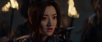 Movie still from “The Great Wall” (2016), directed by Yimou Zhang – A person with long black hair; Close Up shot, Over the shoulder angle