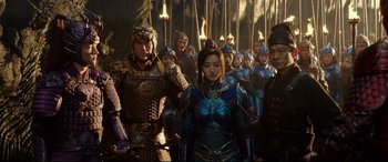 Movie still from “The Great Wall” (2016), directed by Yimou Zhang – A group of men and women standing next to each other; Medium shot, Over the shoulder angle