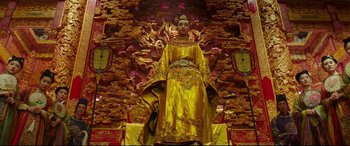 Movie still from “The Great Wall” (2016), directed by Yimou Zhang – A statue of a woman in a yellow dress; Wide shot, Low angle