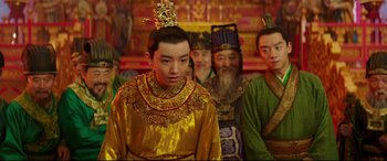 Movie still from “The Great Wall” (2016), directed by Yimou Zhang – A group of men in costume standing next to each other; Medium shot, Over the shoulder angle