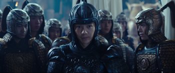Movie still from “The Great Wall” (2016), directed by Yimou Zhang – A group of people wearing armor and helmets; Medium shot, Over the shoulder angle