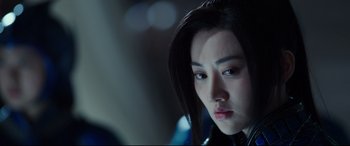 Movie still from “The Great Wall” (2016), directed by Yimou Zhang – A person with long black hair; Close Up shot, Over the shoulder angle