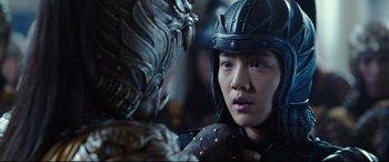 Movie still from “The Great Wall” (2016), directed by Yimou Zhang – A man in a helmet is looking at another man in a helmet; Close Up shot, Over the shoulder angle