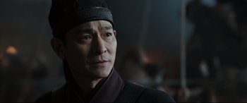 Movie still from “The Great Wall” (2016), directed by Yimou Zhang – A person wearing a hat; Close Up shot, Over the shoulder angle
