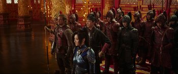 Movie still from “The Great Wall” (2016), directed by Yimou Zhang – A group of people standing in front of a building; Wide shot, Over the shoulder angle