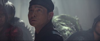 Movie still from “The Great Wall” (2016), directed by Yimou Zhang – A person wearing a hat; Close Up shot, Low angle