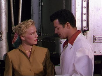 Movie still from “The Greatest Show on Earth” (1952), directed by Cecil B. DeMille – A man and a woman standing next to each other; Medium shot, Over the shoulder angle