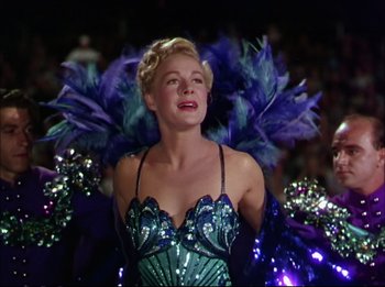 Movie still from “The Greatest Show on Earth” (1952), directed by Cecil B. DeMille – A woman in a blue and purple costume; Medium shot, Low angle