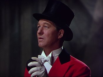 Movie still from “The Greatest Show on Earth” (1952), directed by Cecil B. DeMille – A person wearing a top hat and gloves; Close Up shot, Low angle