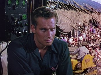 Movie still from “The Greatest Show on Earth” (1952), directed by Cecil B. DeMille – A person sitting in front of a wall; Medium shot, Low angle