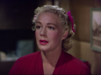 Movie still from “The Greatest Show on Earth” (1952), directed by Cecil B. DeMille – A woman with blonde hair wearing a pink shirt; Close Up shot, Low angle