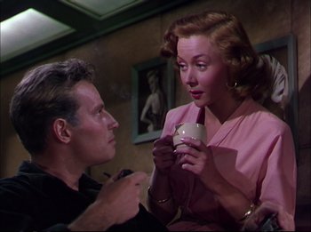 Movie still from “The Greatest Show on Earth” (1952), directed by Cecil B. DeMille – A man and a woman holding a coffee cup; Medium shot, Low angle
