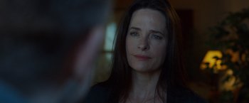 Movie still from “The Guest” (2014), directed by Adam Wingard – A person with long black hair; Close Up shot, Over the shoulder angle