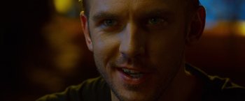 Movie still from “The Guest” (2014), directed by Adam Wingard – A man's face in a dark room; Close Up shot, Over the shoulder angle