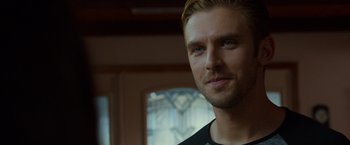 Movie still from “The Guest” (2014), directed by Adam Wingard – A person wearing a black t - shirt; Close Up shot, Over the shoulder angle