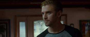 Movie still from “The Guest” (2014), directed by Adam Wingard – A person wearing a shirt; Close Up shot, Over the shoulder angle