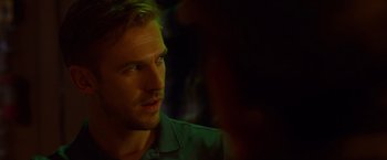 Movie still from “The Guest” (2014), directed by Adam Wingard – A person wearing a green shirt; Close Up shot, Over the shoulder angle
