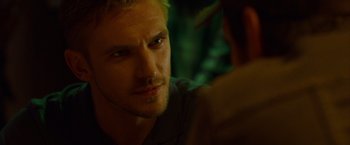Movie still from “The Guest” (2014), directed by Adam Wingard – A person looking at the camera; Close Up shot, Over the shoulder angle
