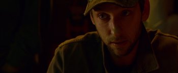 Movie still from “The Guest” (2014), directed by Adam Wingard – A person wearing a hat; Close Up shot, Low angle