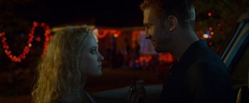Movie still from “The Guest” (2014), directed by Adam Wingard – A man and a woman looking at each other; Close Up shot, Over the shoulder angle