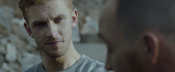 Movie still from “The Guest” (2014), directed by Adam Wingard – A person looking at another person; Close Up shot, Over the shoulder angle