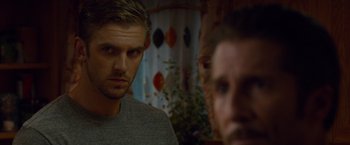 Movie still from “The Guest” (2014), directed by Adam Wingard – A person looking at another person; Close Up shot, Over the shoulder angle