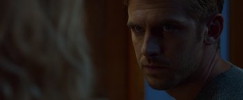 Movie still from “The Guest” (2014), directed by Adam Wingard – A man's face in the dark; Extreme Close Up shot, Over the shoulder angle