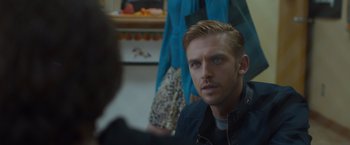 Movie still from “The Guest” (2014), directed by Adam Wingard – A person sitting in front of another person; Close Up shot, Over the shoulder angle