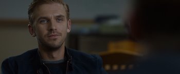 Movie still from “The Guest” (2014), directed by Adam Wingard – A person wearing a jacket; Close Up shot, Over the shoulder angle