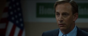 Movie still from “The Guest” (2014), directed by Adam Wingard – A person wearing a suit and tie; Close Up shot, Over the shoulder angle