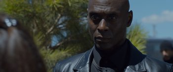 Movie still from “The Guest” (2014), directed by Adam Wingard – A person wearing a black jacket; Close Up shot, Over the shoulder angle