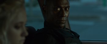 Movie still from “The Guest” (2014), directed by Adam Wingard – A person wearing a black jacket; Close Up shot, Over the shoulder angle