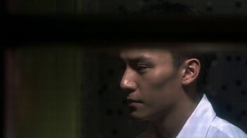Movie still from “The Hand” (2004), directed by Kar-Wai Wong – A person with his eyes wide open; Close Up shot, Low angle