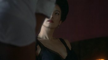Movie still from “The Hand” (2004), directed by Kar-Wai Wong – A woman in a black dress and a black hat; Close Up shot, Over the shoulder angle