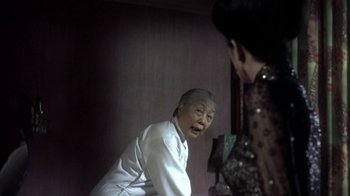 Movie still from “The Hand” (2004), directed by Kar-Wai Wong – An older woman is looking at a younger woman; Close Up shot, Over the shoulder angle