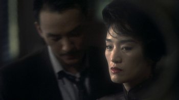 Movie still from “The Hand” (2004), directed by Kar-Wai Wong – A man and a woman are looking at each other; Close Up shot, Over the shoulder angle