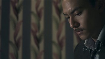 Movie still from “The Hand” (2004), directed by Kar-Wai Wong – A person with a mustache; Close Up shot, Low angle
